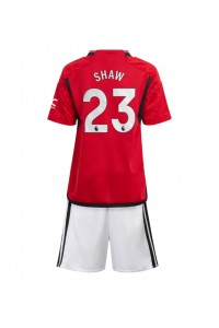 Manchester United Luke Shaw #23 Jalkapallovaatteet Lasten Kotipeliasu 2023-24 Lyhythihainen (+ Lyhyet housut)